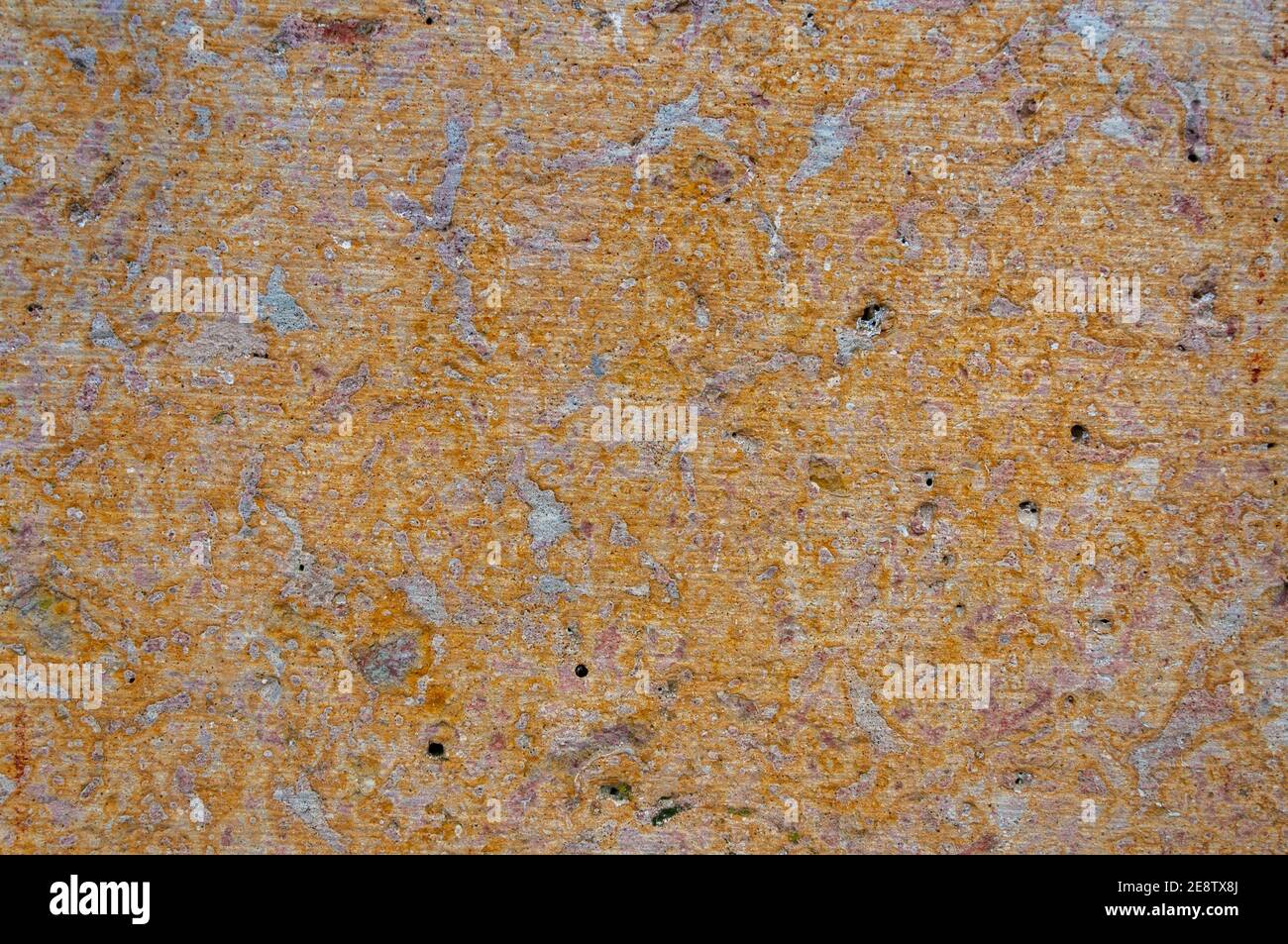 Sandstone surface yellow biege patterned texture background Stock Photo