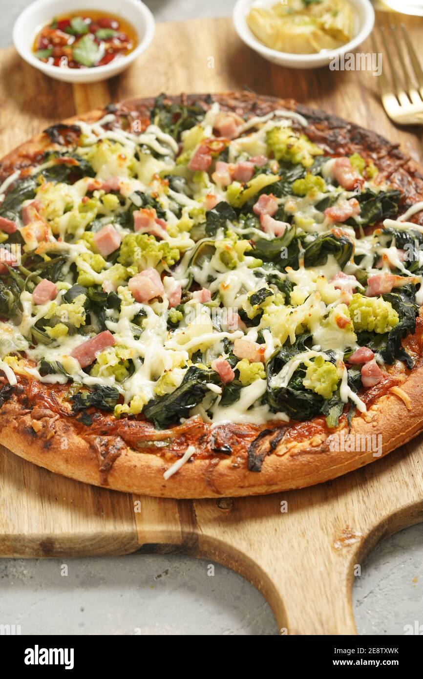 Home made pizza with spinach and cheese Stock Photo
