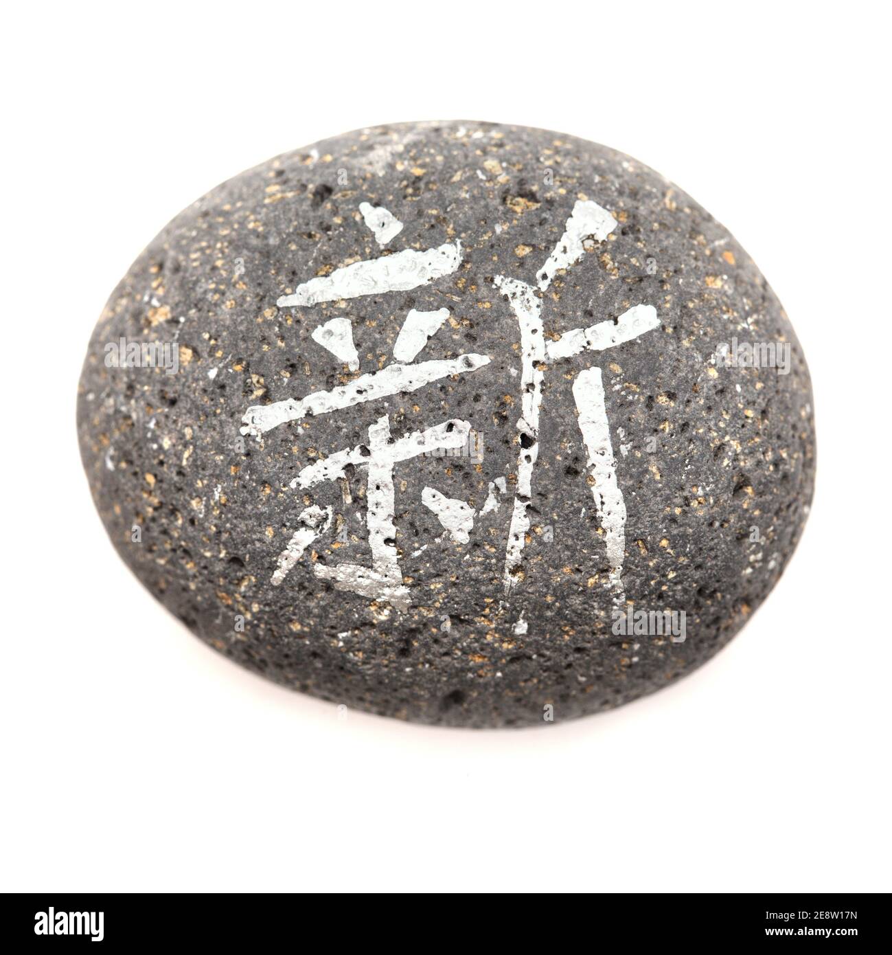 Chinese character xin, meaning new written on a volcanic rock pebble
