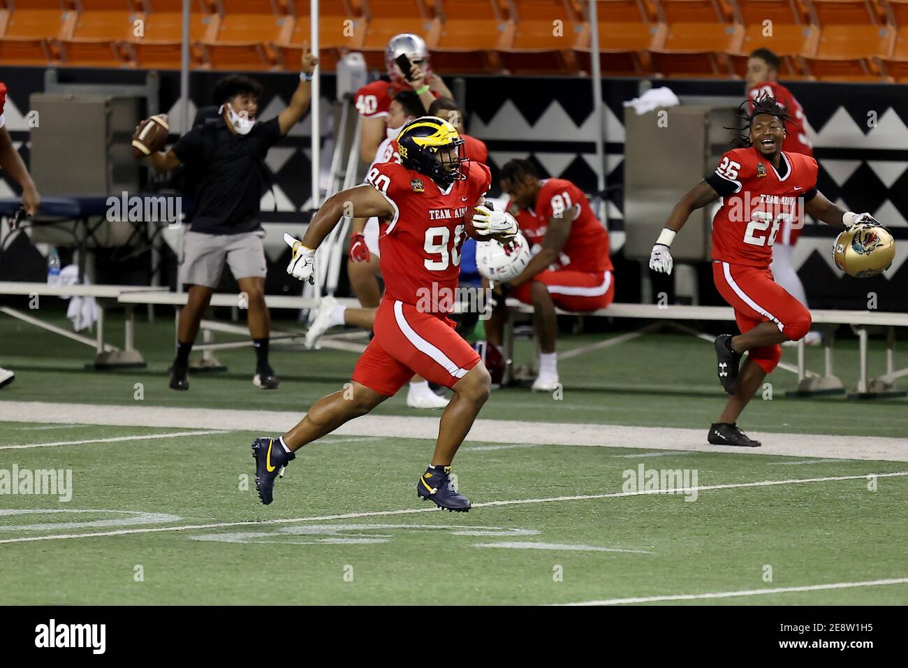 January 31, 2021 - Michigan Wolverines defensive lineman Carlo Kemp #90 rushes downfield and scores a touchdown during the Hula Bowl at Aloha Stadium in Honolulu, HI - Andrew Lee/CSM Stock Photo