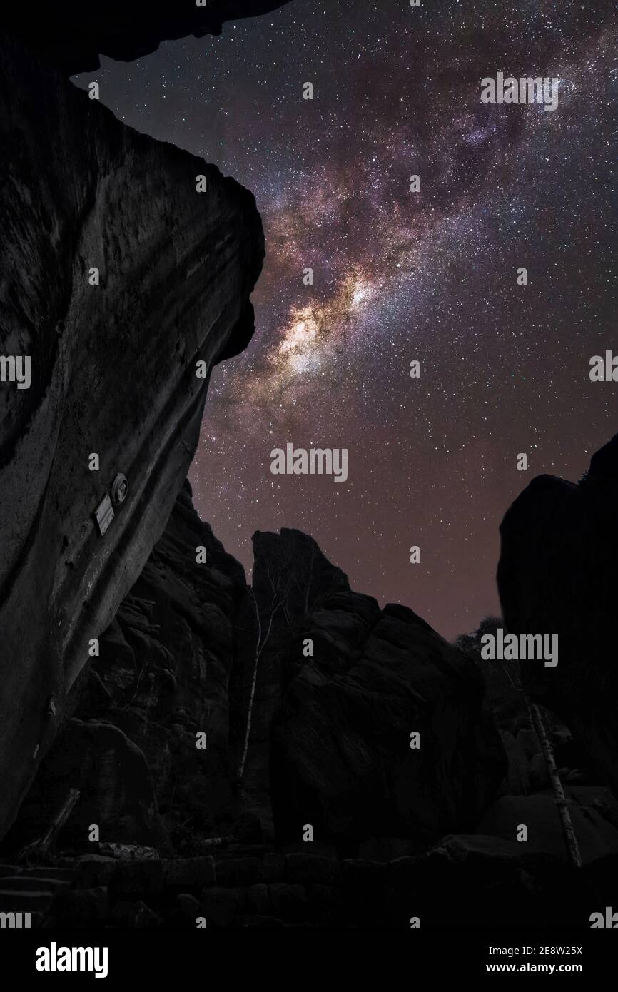 Vertical shot of rocks under the breathtaking starry night sky Stock ...