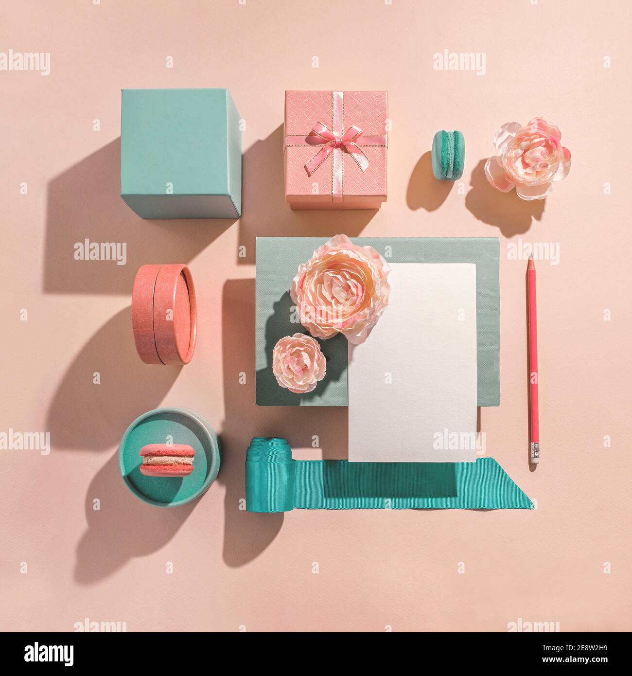 Festive geometric arrangement of gift boxes in muted pastel colors. Congratulations on women's day and birthday. Romantic concept for womens party Stock Photo