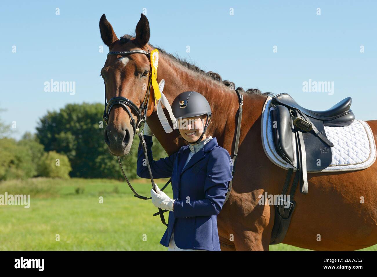 Happy young rider after winning a competition Stock Photo - Alamy