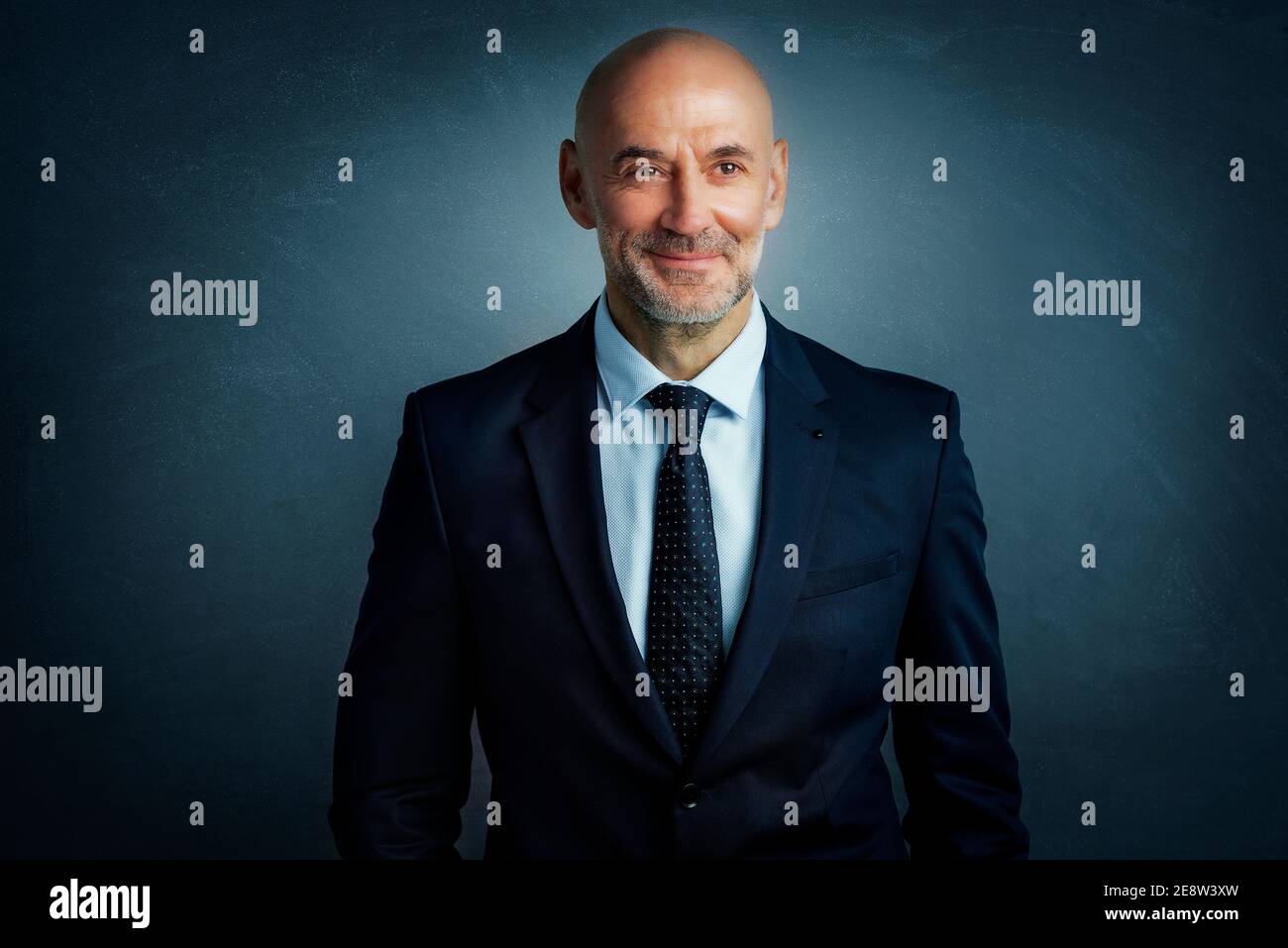 Studio portrait shot of middle aged businessman wearing suit and tie ...