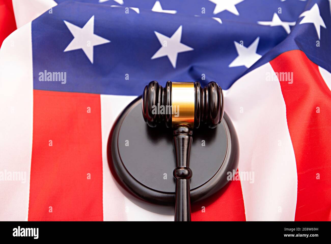 Wooden judge gavel  USA flag as background, concept picture about justice in the USA Stock Photo
