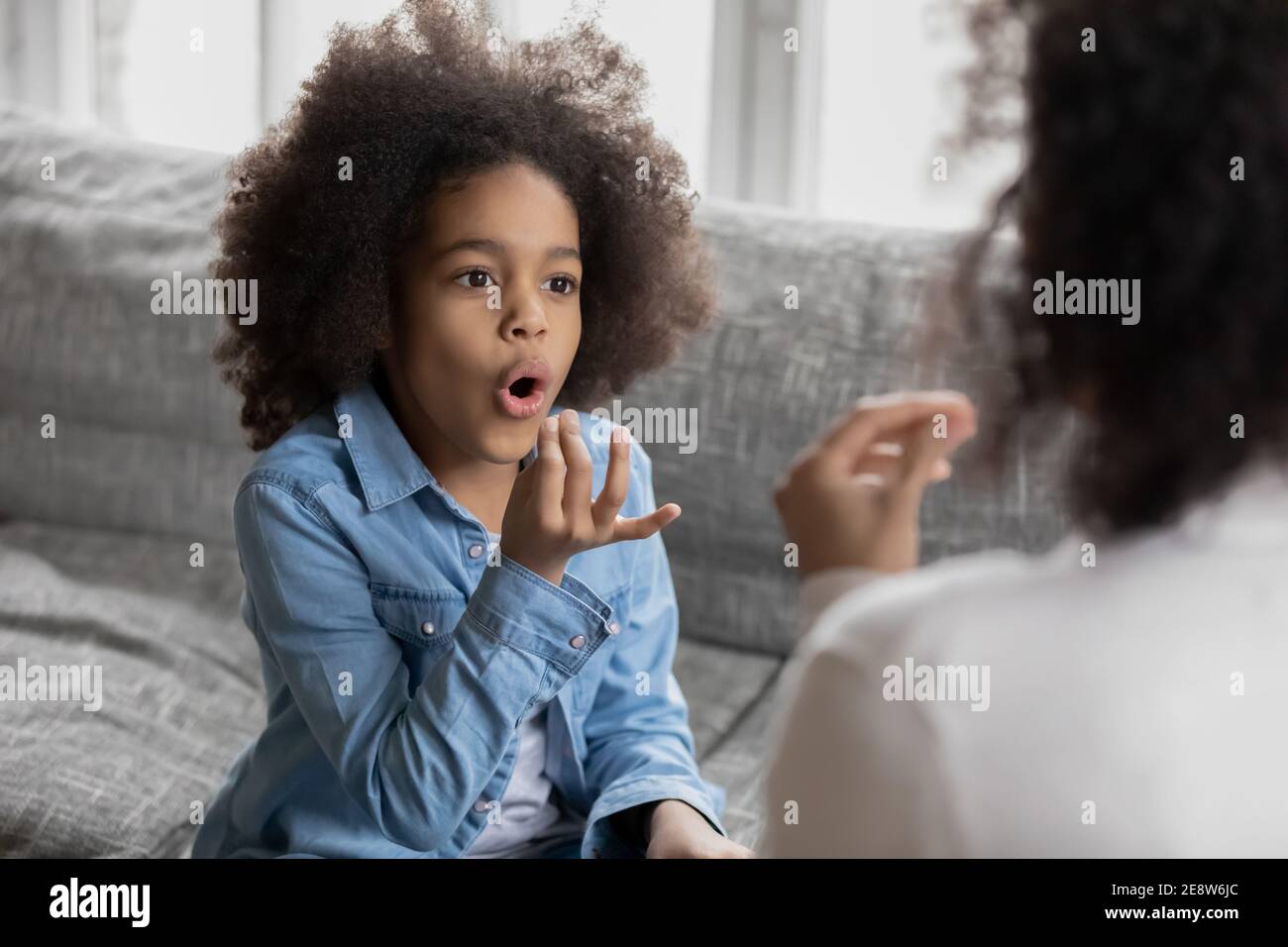 Close up disabled African American girl practicing sign language Stock Photo