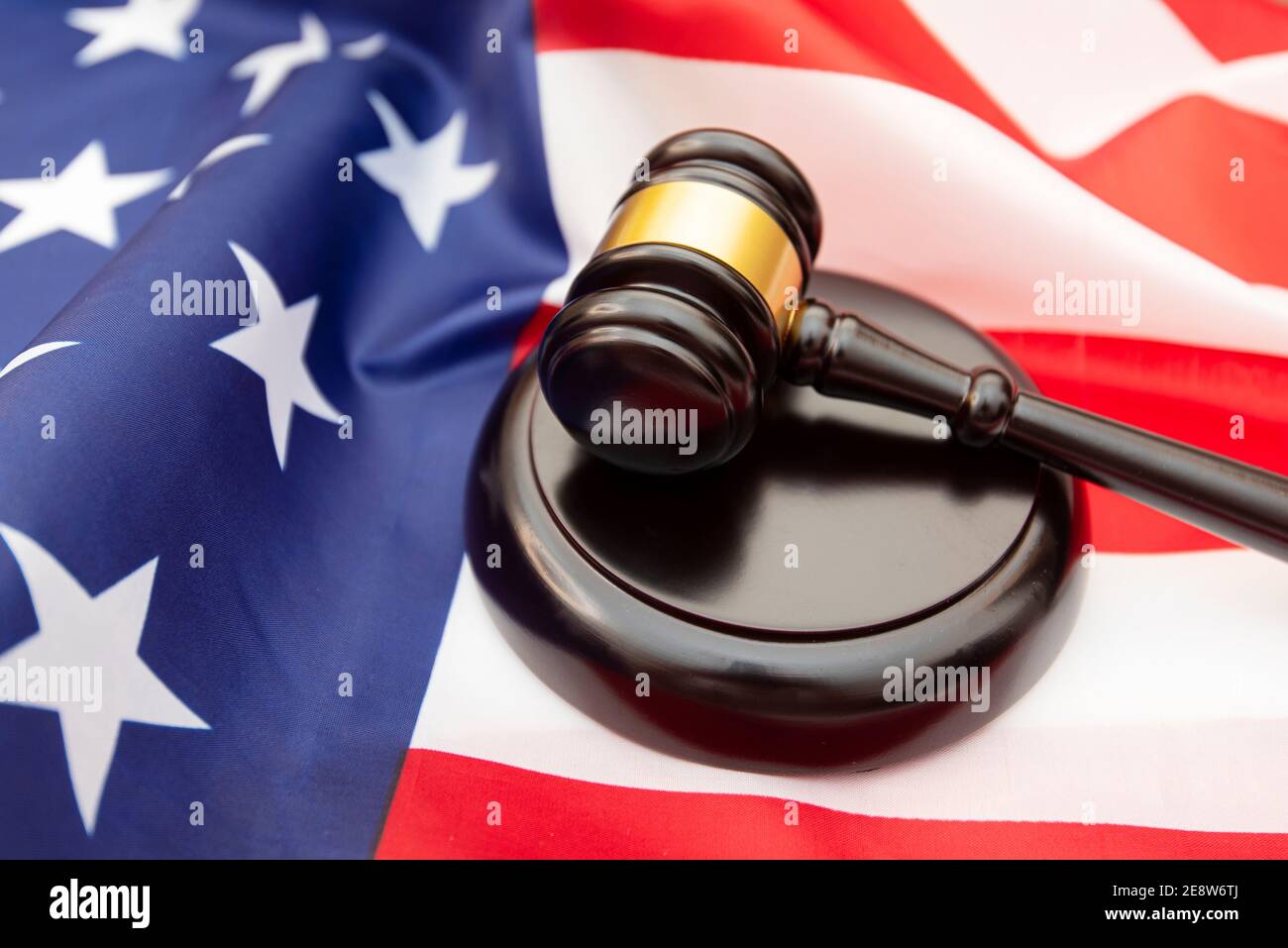 Wooden judge gavel  USA flag as background, concept picture about justice in the USA Stock Photo