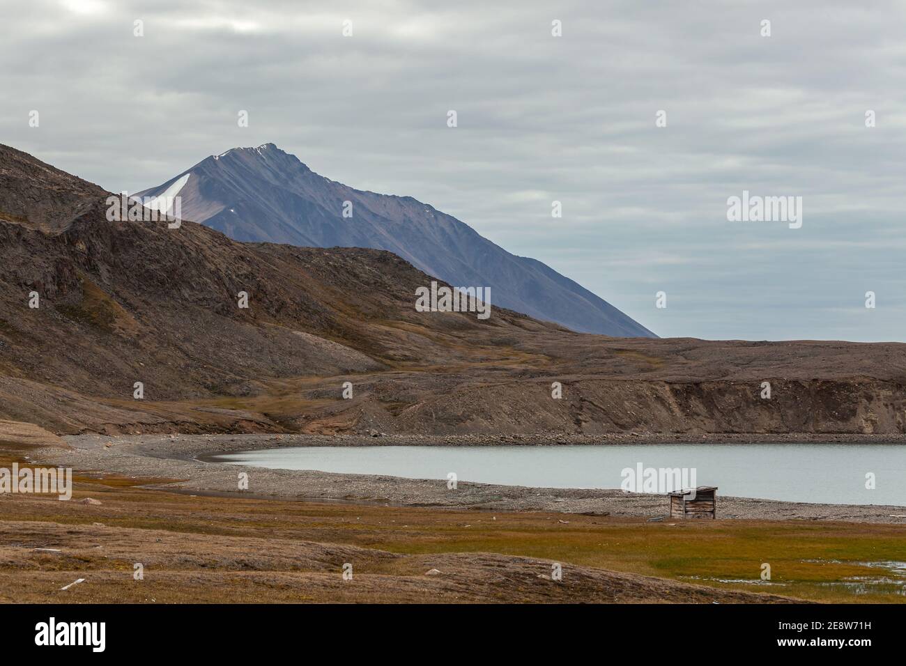 Dundas Harbour (Devon Island) during summer, with mountains in background Stock Photo