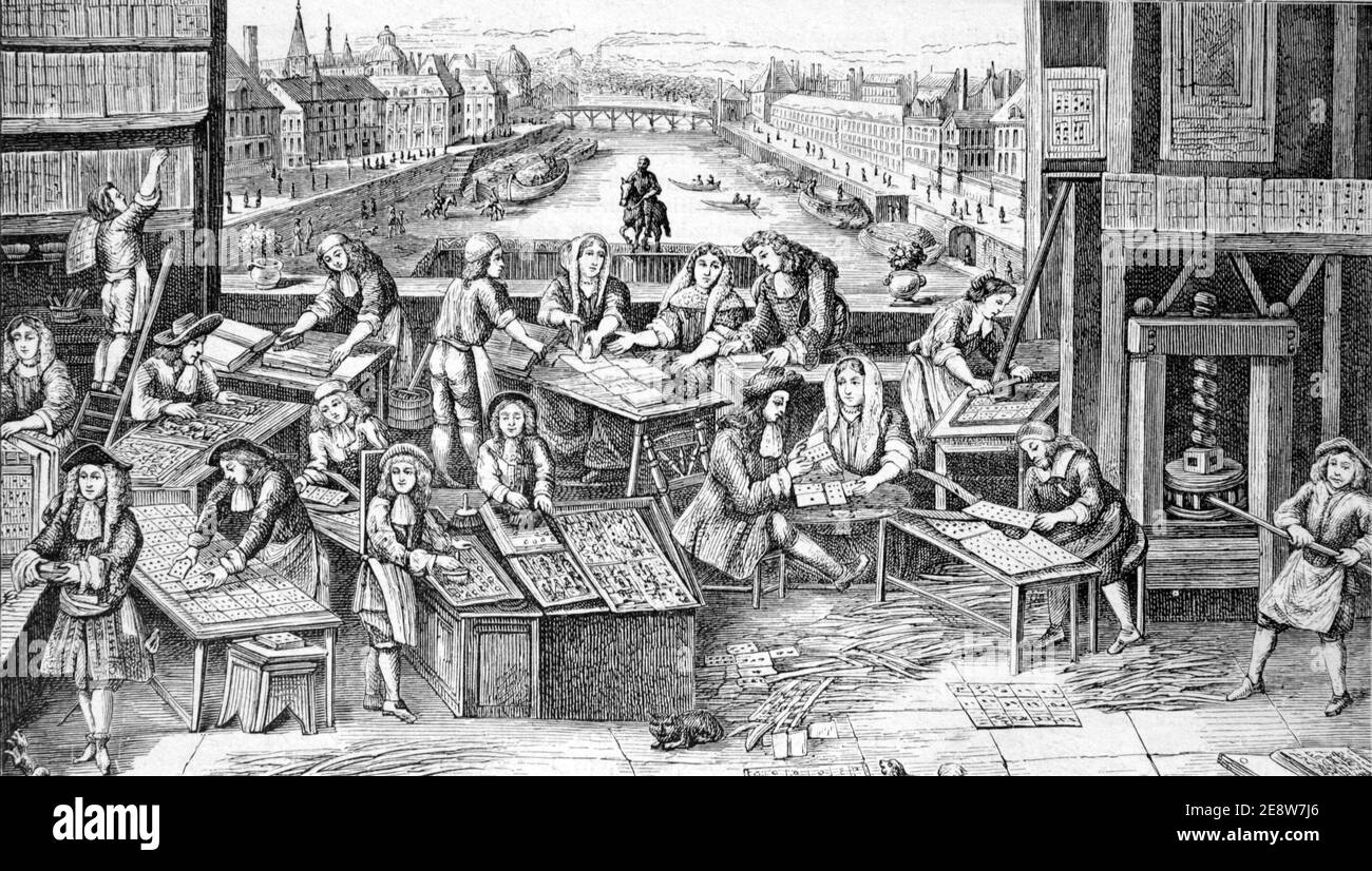 Playing Cards Factory in Paris, France during the reign of King louis XIV (1643-1715) Against Backdrop of River Seine in Paris France. Vintage Illustration or Wood Engraving Stock Photo