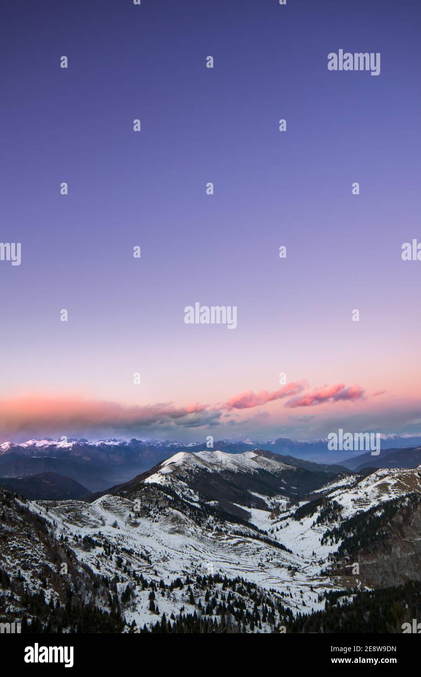 Scenic purple sky over snowy mountainsc Stock Photo