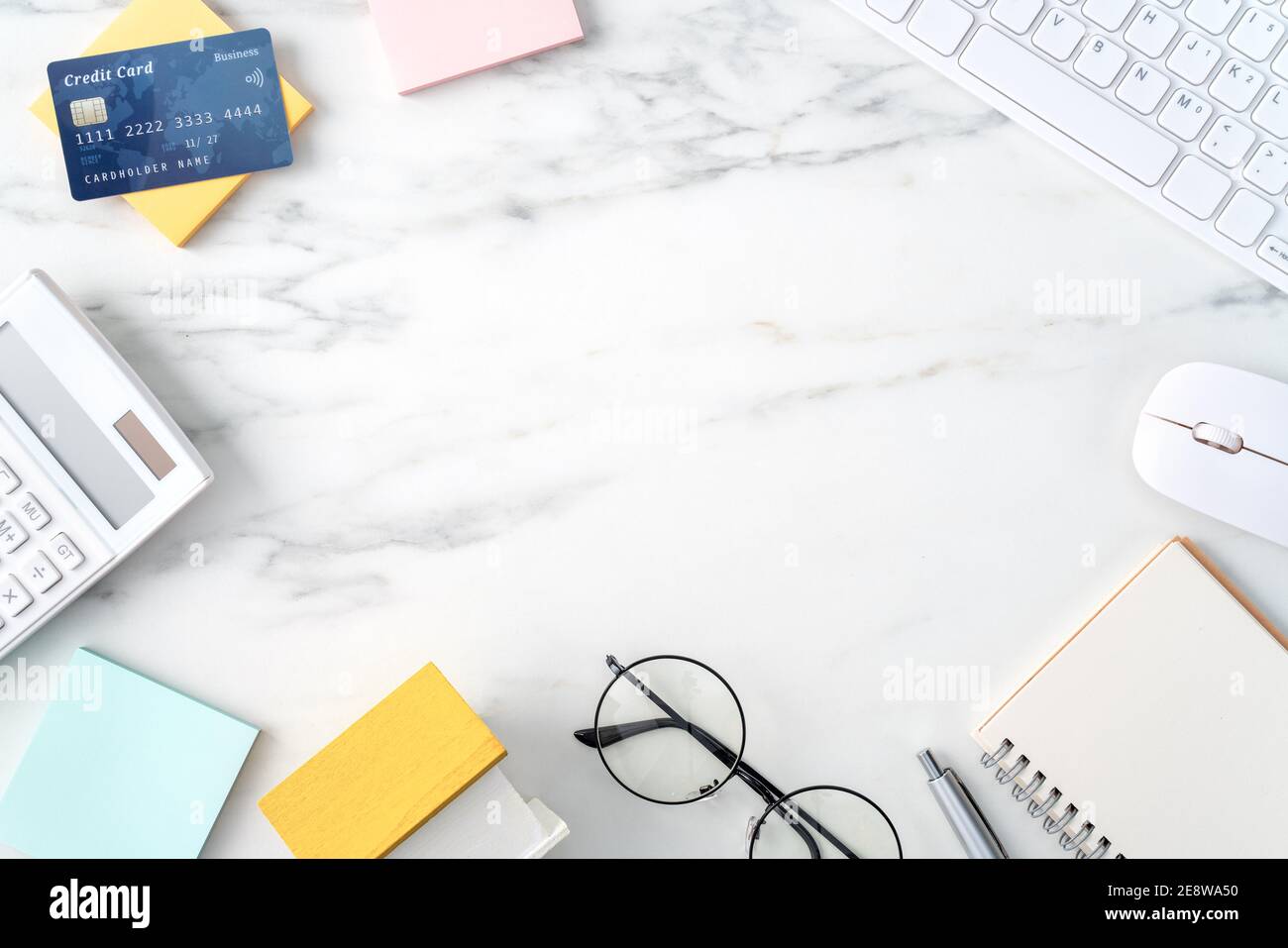 Top view of estimating and paying house tax with calculator and credit