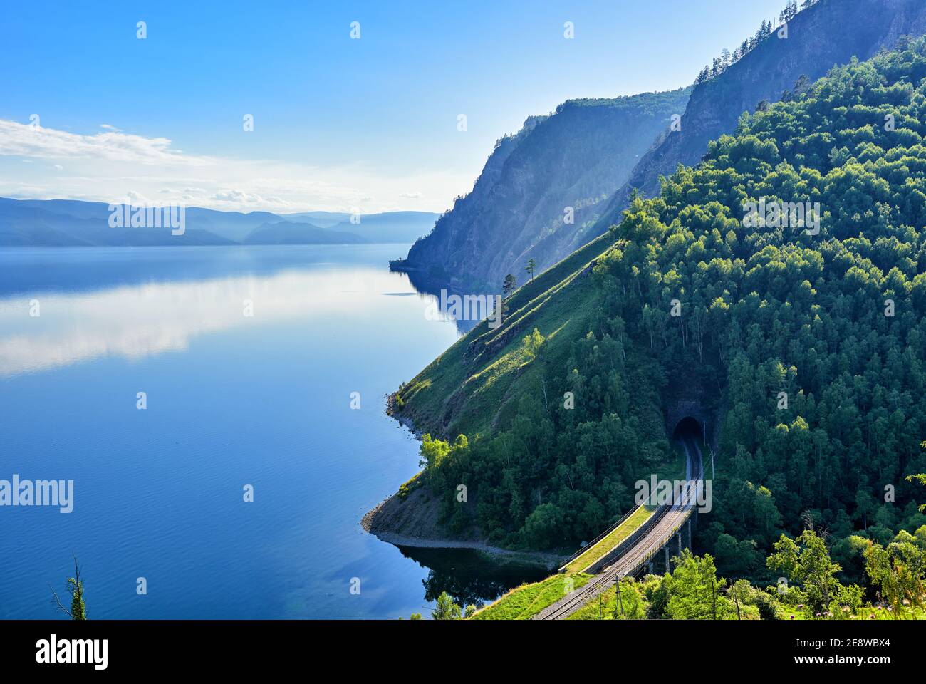 Calm on Lake Baikal. Large-scale top view of Lake Baikal and the section of the Circum-Baikal Railway at the Irkutsk portal of tunnel No. 33. In the b Stock Photo