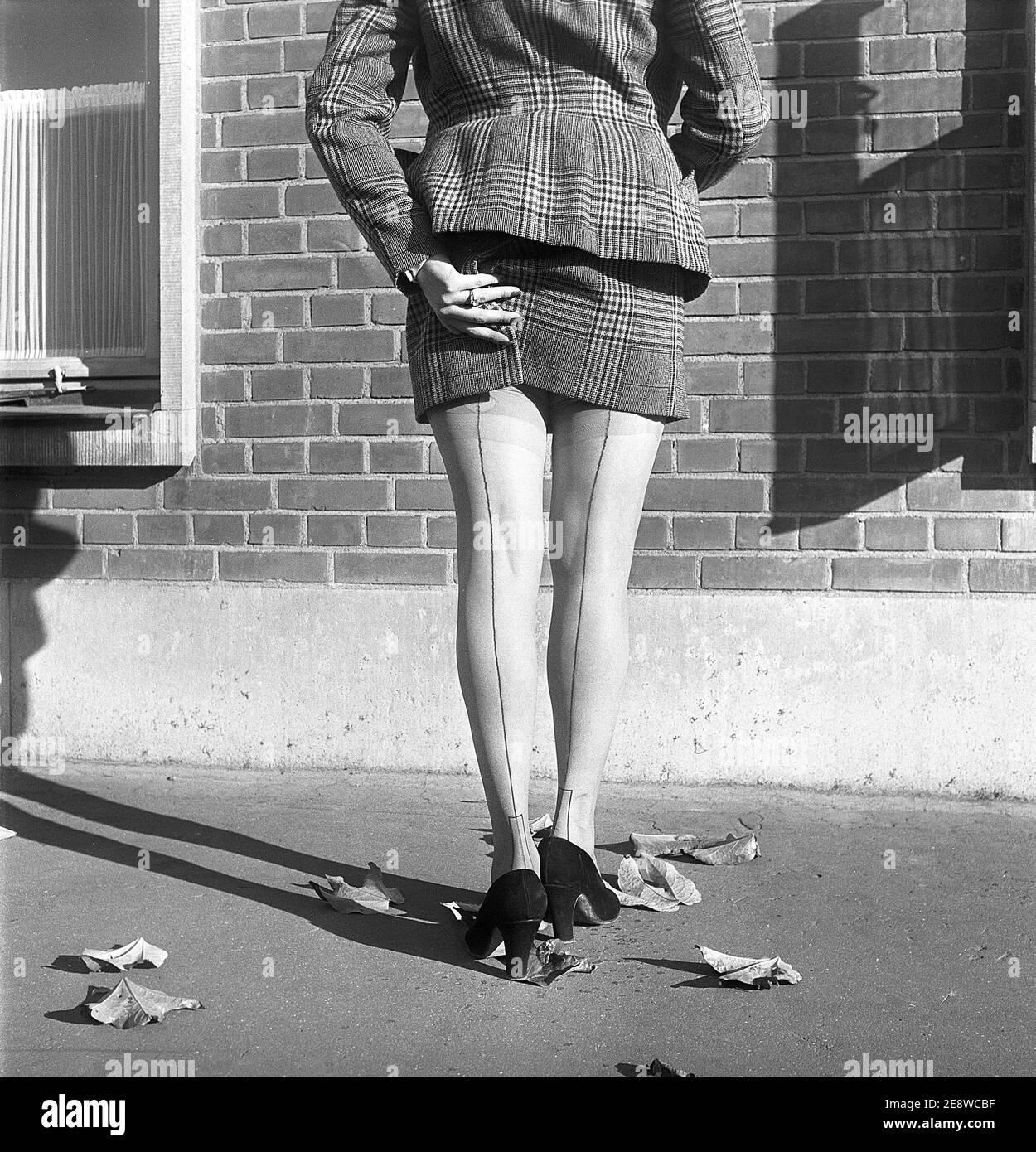 Nylon stockings in the 1950s. The model Solveij Nyhlén pictured outside the swedish factory of nylon stockings, Malmö strumpfabrik. Established 1926 and became the leading manufacturer of silk stockings in sweden. At this time 1951 the company had invested in new machinery to make the popular nylon stockings. Ref BE19-11 Stock Photo