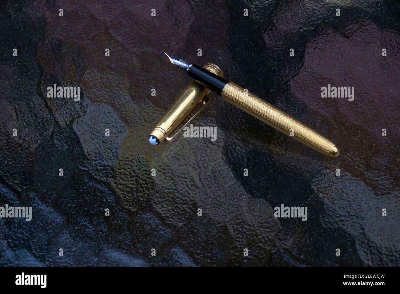 A still life of a gold  Mont Blanc Solitaire fountain pen from the 1990's. Stock Photo