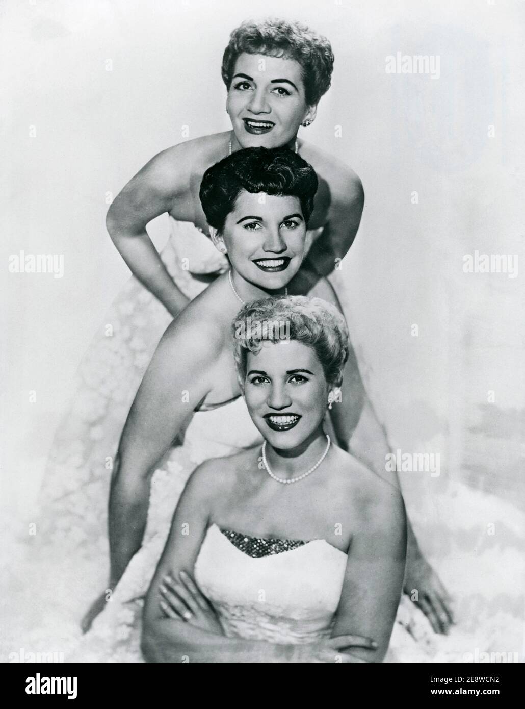 The Andrew Sisters. An American close harmony singing group of the swing and boogie-woogie eras. The group consisted of three sisters: contralto LaVerne Sophia (July 6, 1911 – May 8, 1967), soprano Maxene Anglyn (January 3, 1916 – October 21, 1995), and mezzo-soprano Patricia Marie 'Patty' (February 16, 1918 – January 30, 2013). One of their biggest hits is Rum and Coca Cola.  Pictured here in 1957. Stock Photo