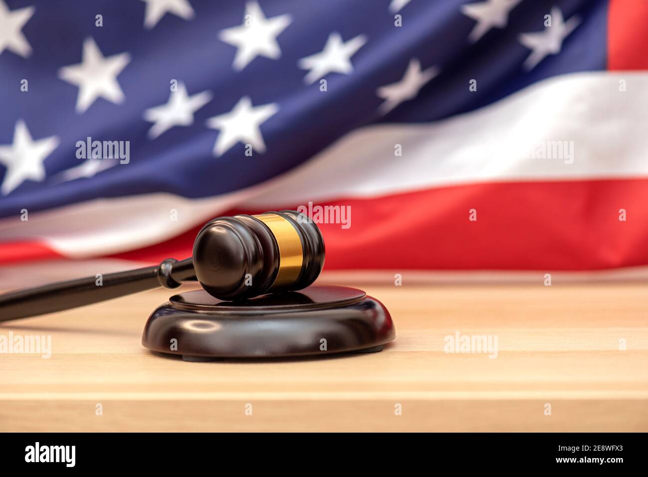 Wooden judge gavel USA flag as background, concept picture about justice in the USA Stock Photo