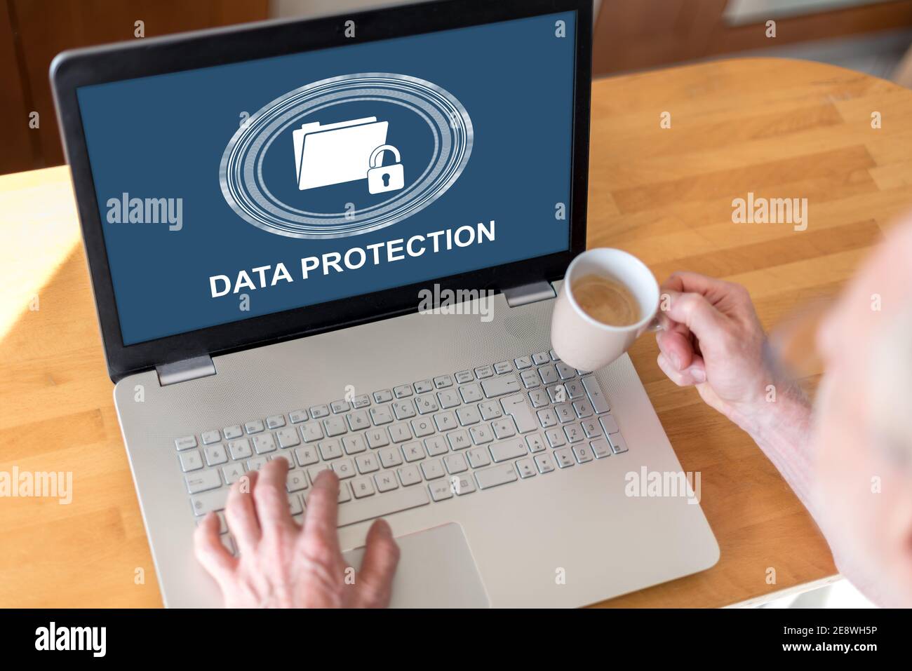 Man using a laptop with data protection concept on the screen Stock ...