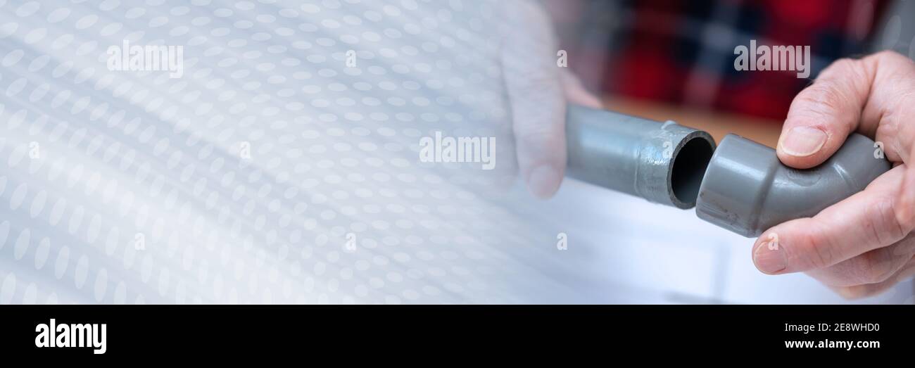 Plumber joining pvc pipe and fitting; panoramic banner Stock Photo Alamy