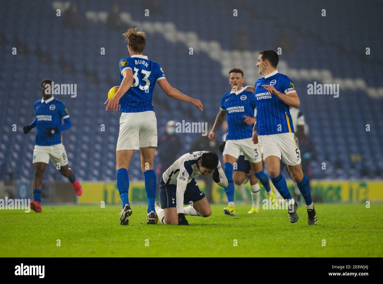 Brighton And Hove, UK. 31st Jan, 2021. Dan Burn of Brighton & Hove Albion (33) catches Son Heung-Min of Tottenham Hotspur in the face and is shown the yellow card by Referee Peter Bankes during the Premier League match at the American Express Community Stadium, Brighton and Hove Picture by Alan Stanford/Focus Images/Sipa USA 31/01/2021 Credit: Sipa USA/Alamy Live News Stock Photo