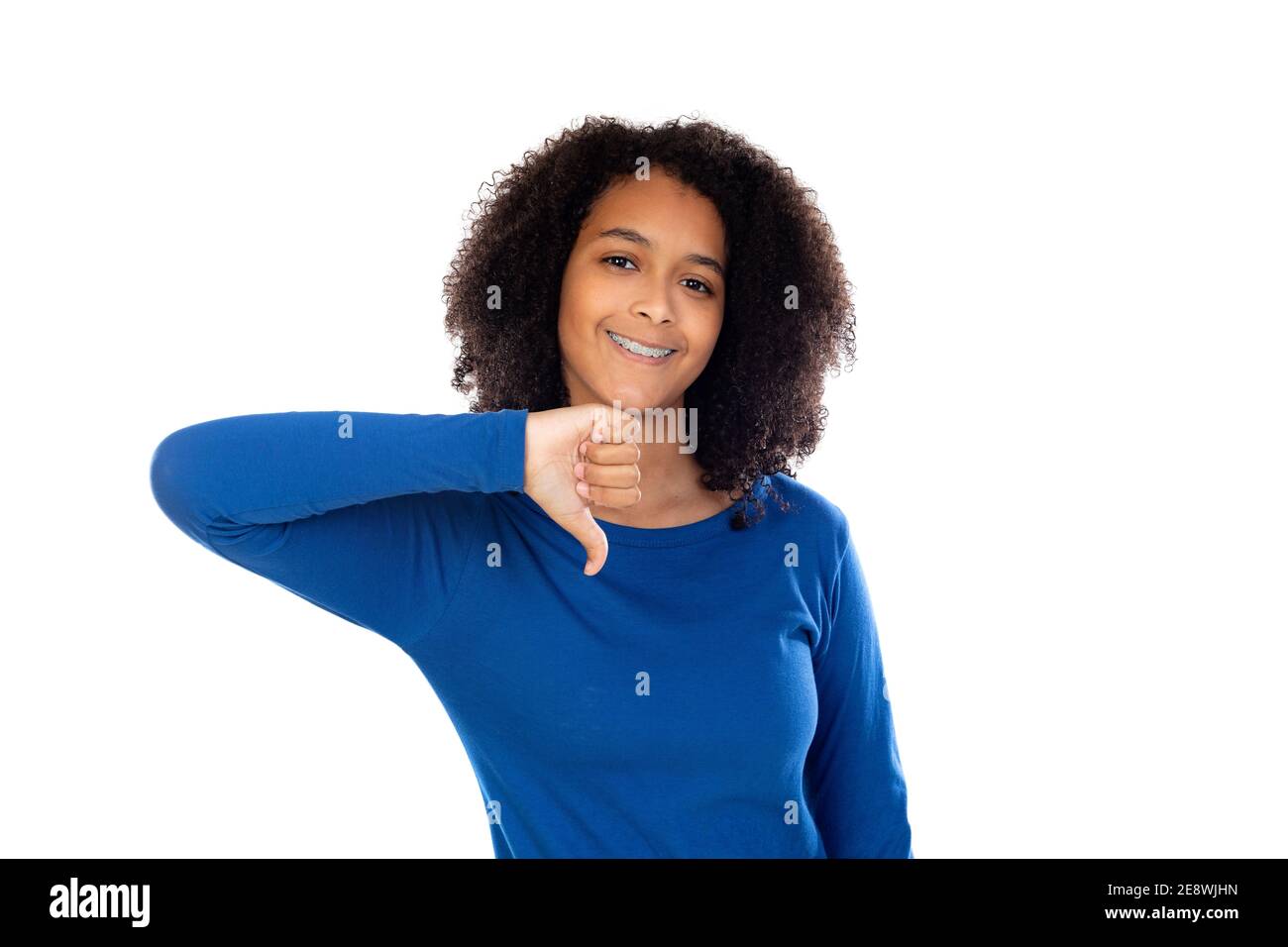 Teenager girl with afro hair wearing blue sweater isolated on a white ...