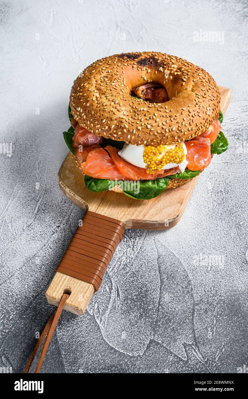 Bagel with salted salmon, cream cheese, avocado and egg. Gray