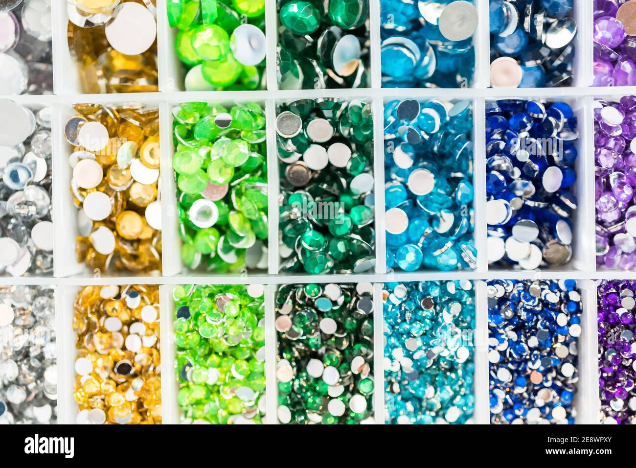 Comparing Craft Rhinestones Color and size variety of rhinestones in the craft box Stock Photo - Alamy