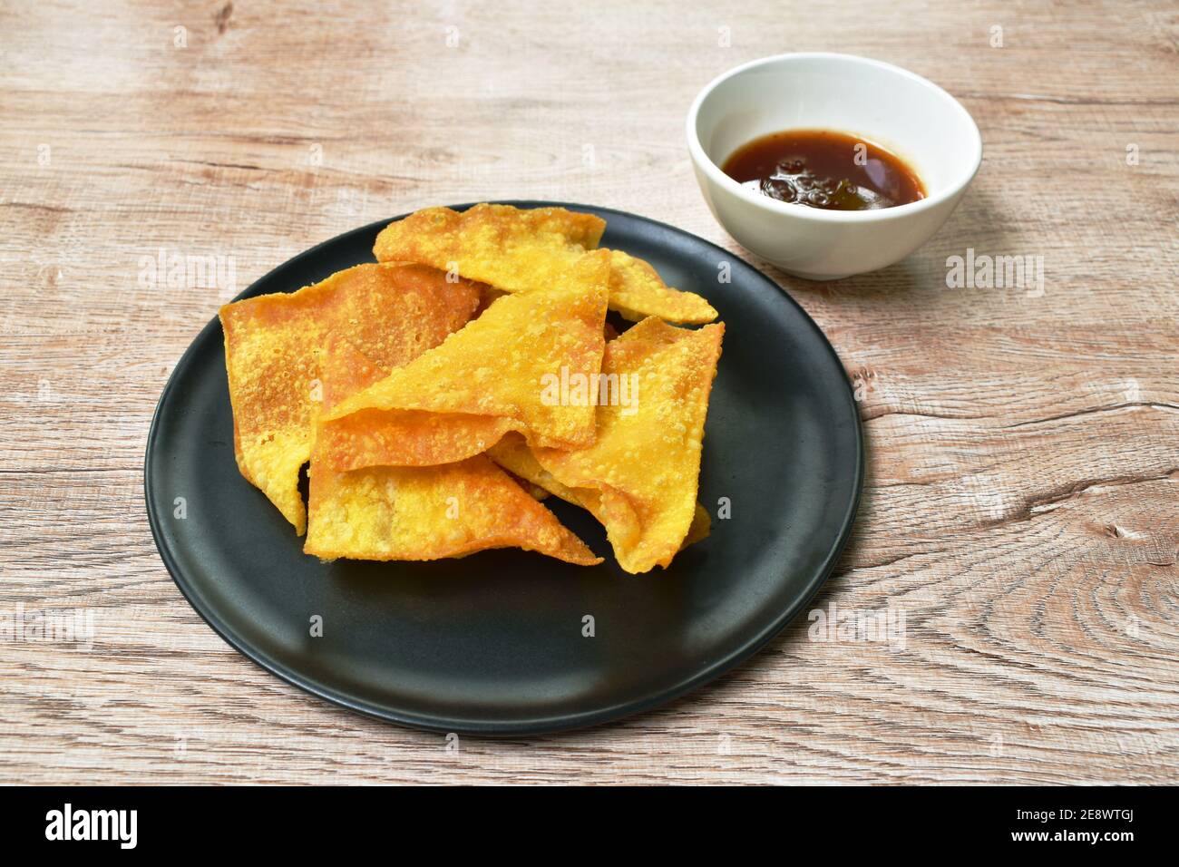 crispy fried dumpling paste dipping sweet chili sauce on plate Stock