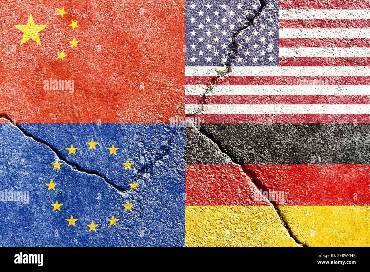 Closeup of USA, China, EU, and Germany flags on weathered and cracked wall background Stock Photo