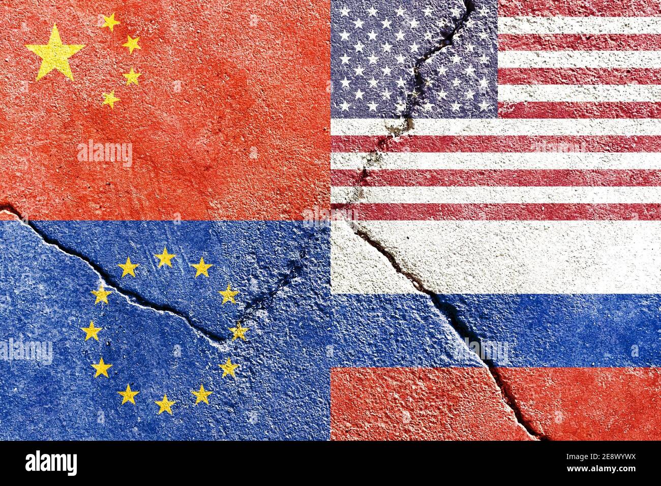 Closeup of USA, China, EU, and Russia flags on weathered and cracked wall background Stock Photo