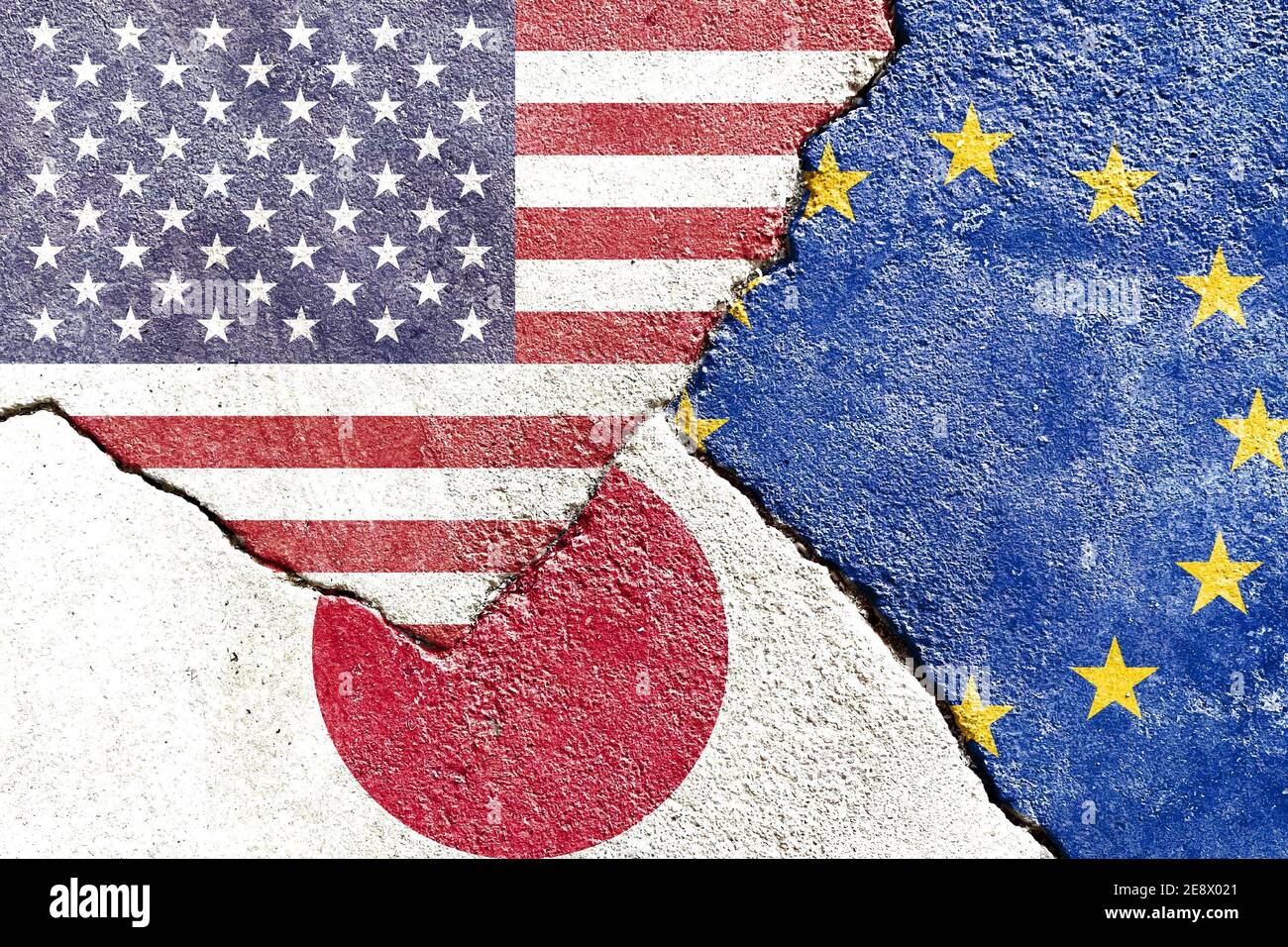 Closeup of USA, Japan, and EU flags on weathered and cracked wall background Stock Photo