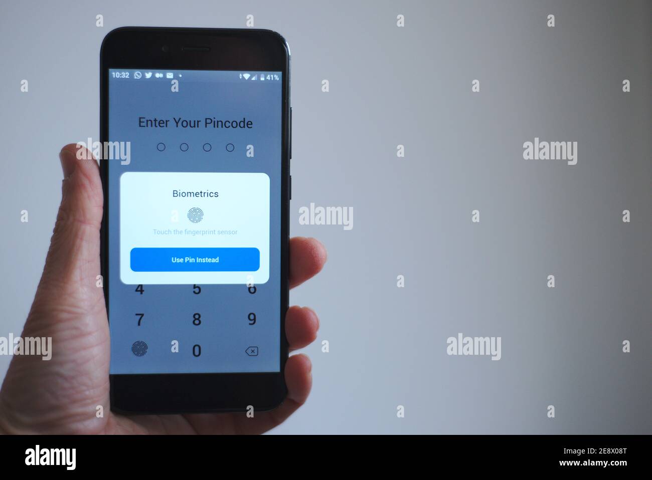 Phone app with biometric fingerprint login enabled Stock Photo