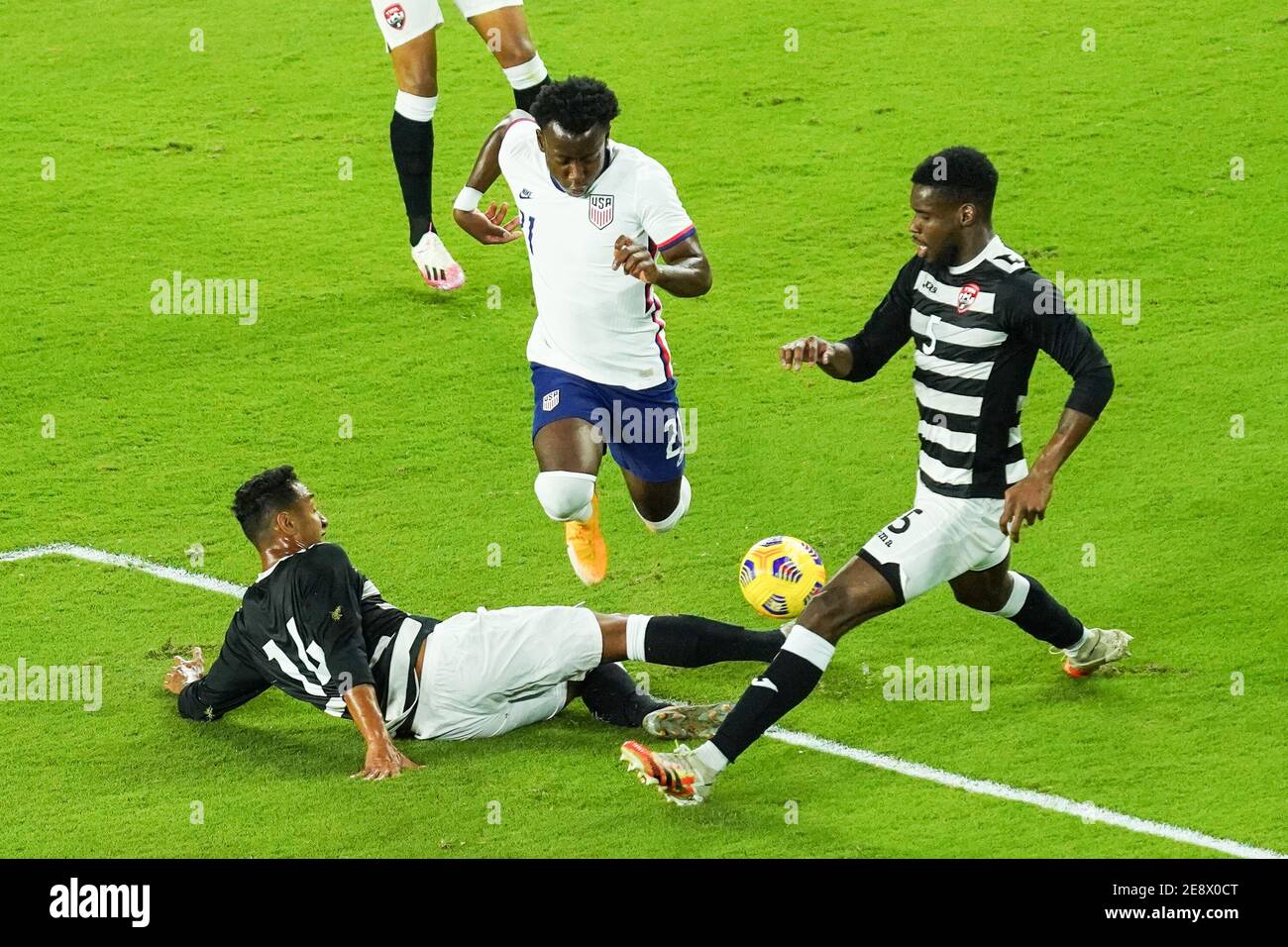 Orlando, Florida, USA, January 31, 2021, Trinidad and Tobago defender Alvin Jones #16 makes a slide tackle during an International Friendly Match against USA.  (Photo Credit:  Marty Jean-Louis) Stock Photo