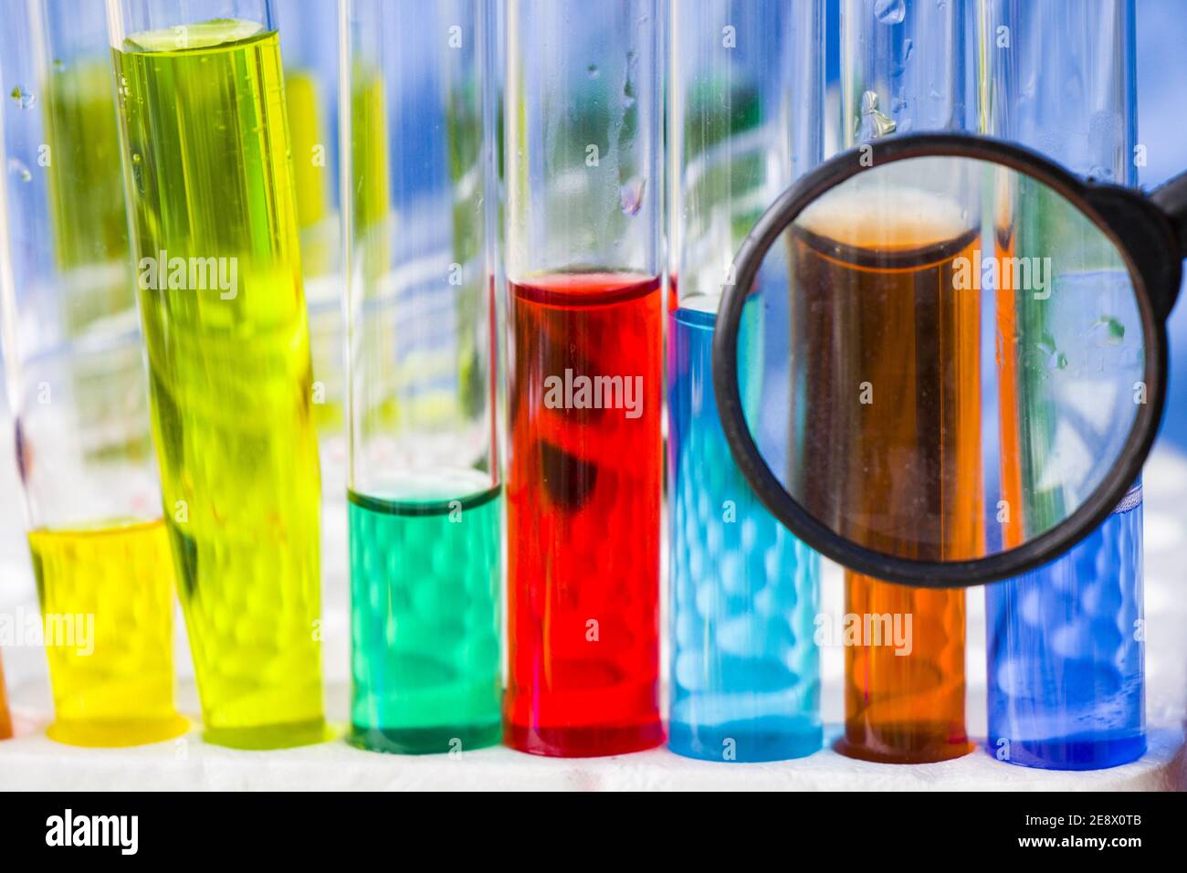 Closeup shot of medical glass containers filled with chemicals through