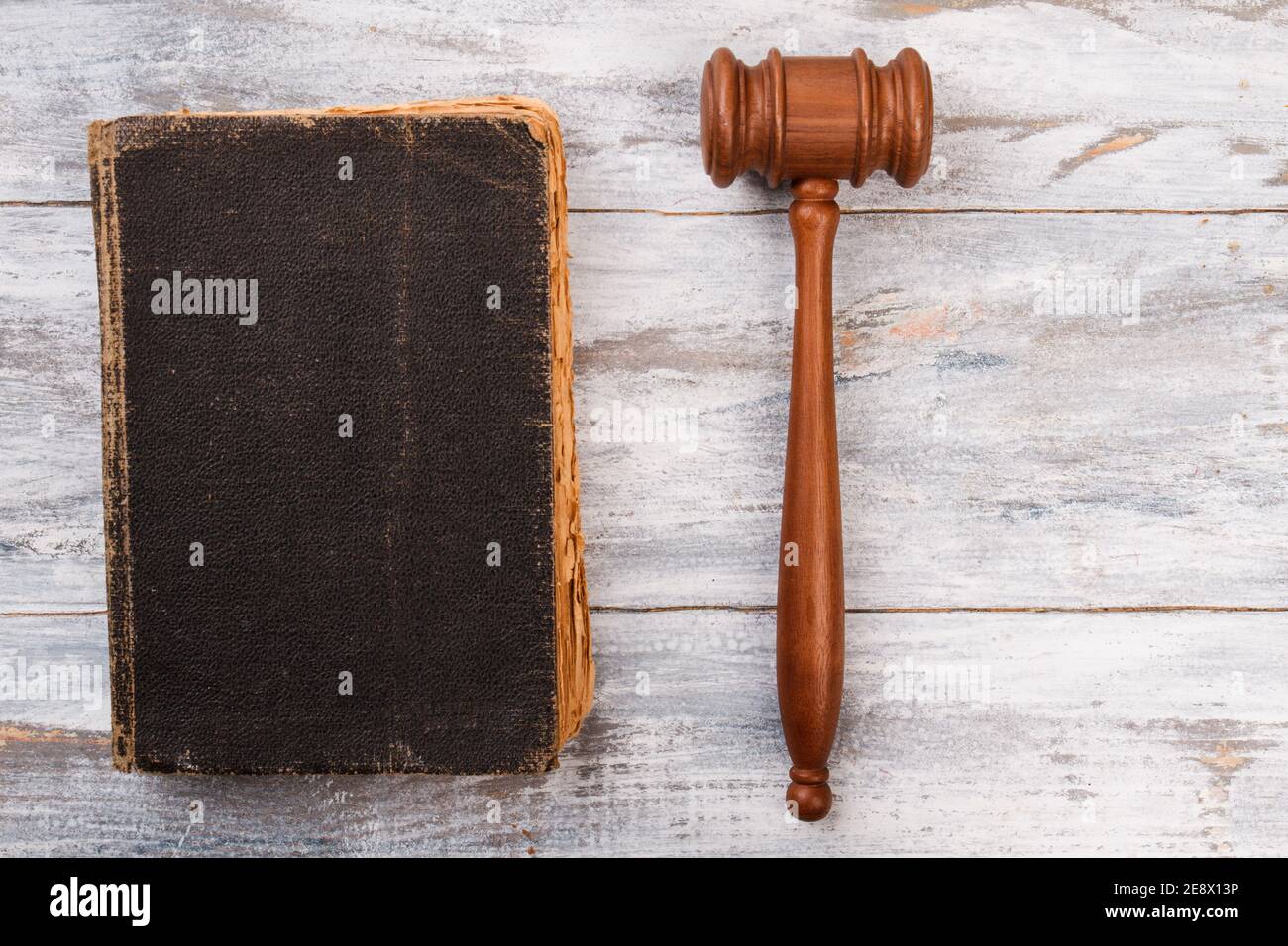 Very old law book and gavel on white wood Stock Photo Alamy