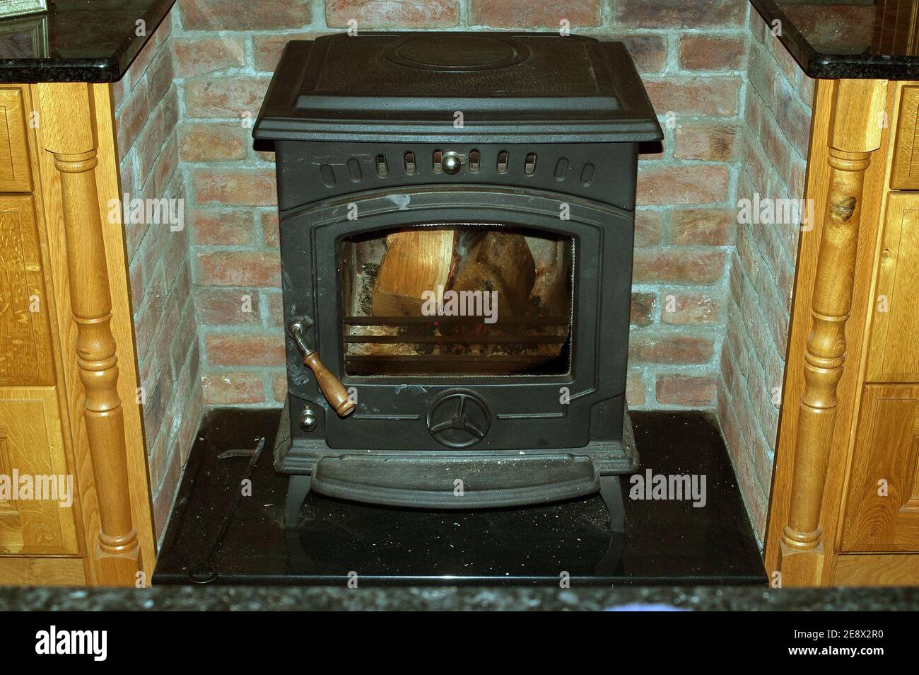 Wood burning stove in the kitchen, Bunclody, County Wexford, Ireland, Europe Stock Photo