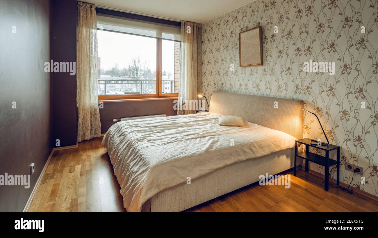 Image showcasing Modern interior of bedroom in luxury apartment. Cozy bed. Huge window ...