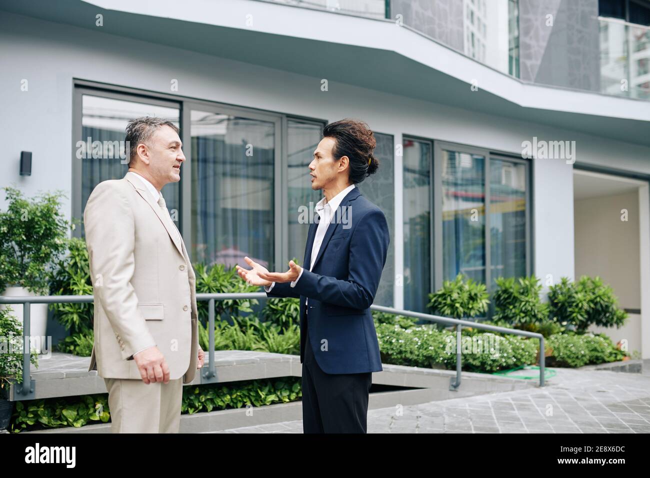 Talking serious business people Stock Photo