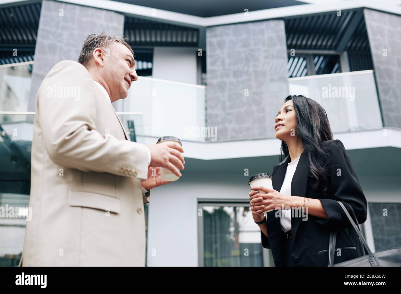 Talking colleagues drinking coffee Stock Photo