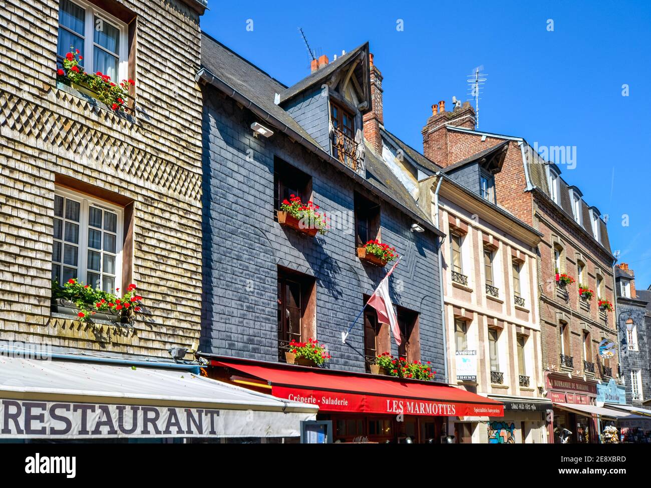 General view of the facade and awning of the Les Marmottes Creperie and restaurant in the Normandy town of Honfleur, France Stock Photo