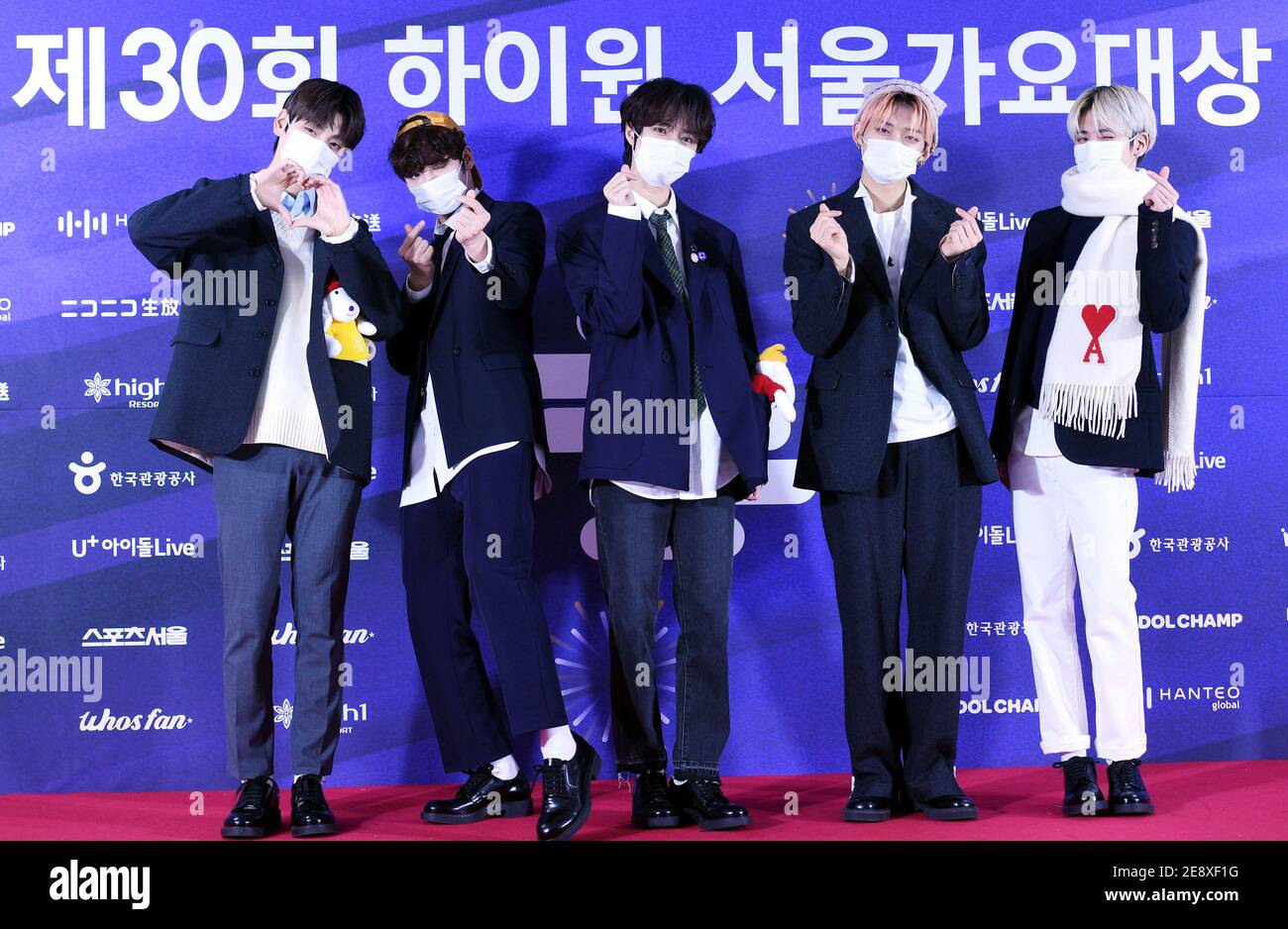 31 January 2021 - Seoul, South Korea : (In This Handout Photos released by  The Sport Seoul) South Korean K-Pop boy band TXT (Tomorrow by Together),  attend a photo call for the