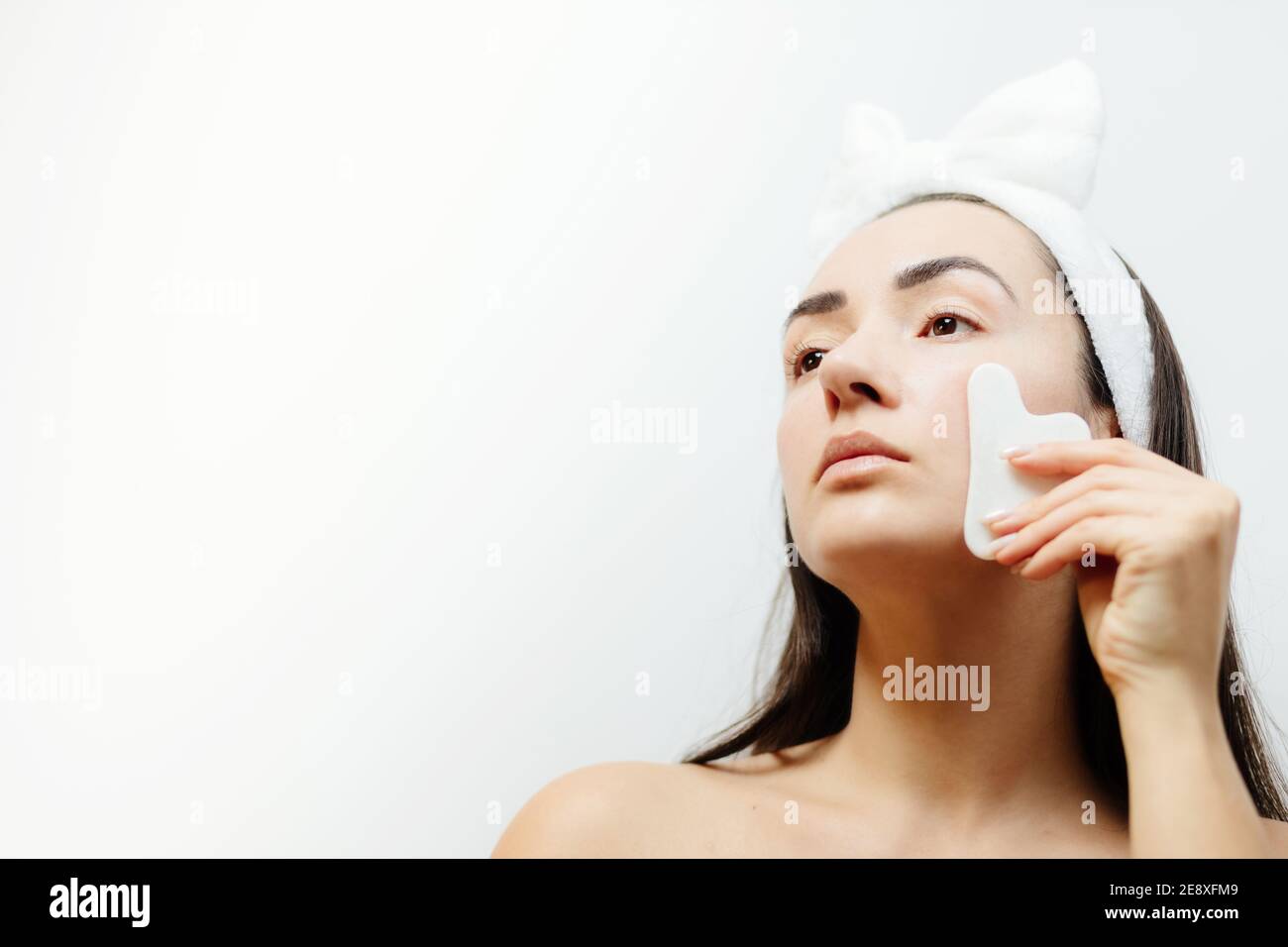 woman using gouache scraper massager Stock Photo