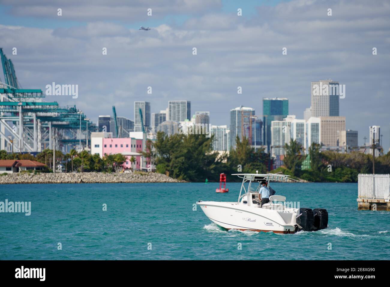 Men cruising on a boston whaler boat in Miami Beach FL Stock Photo