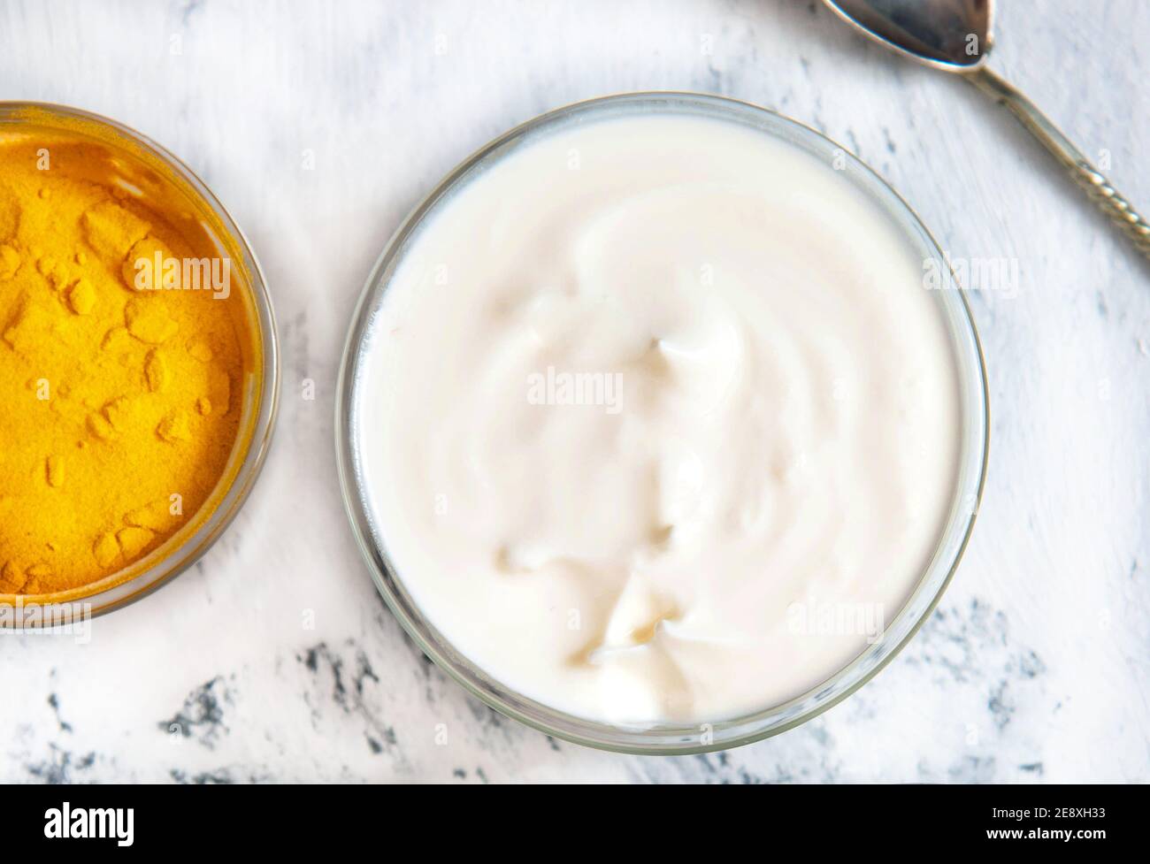 Natural face mask with turmeric powder and yogurt. Natural cosmetics