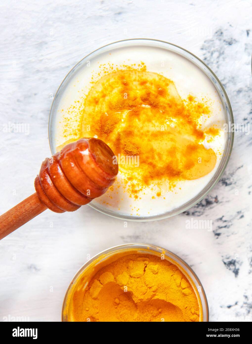 Natural face mask with turmeric powder and yogurt. Natural cosmetics on