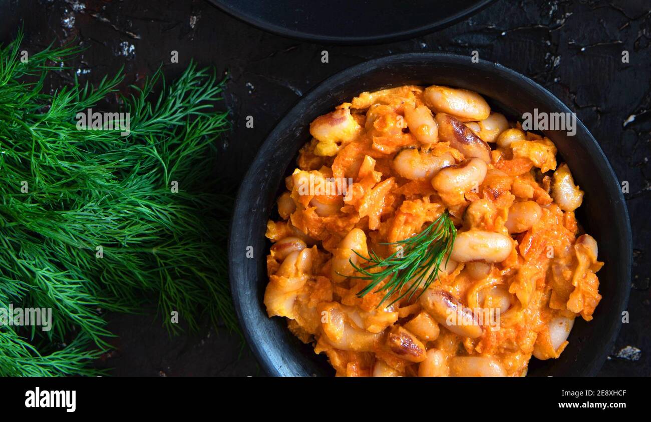 Stewed white beans with carrot in tomato sauce Stock Photo Alamy
