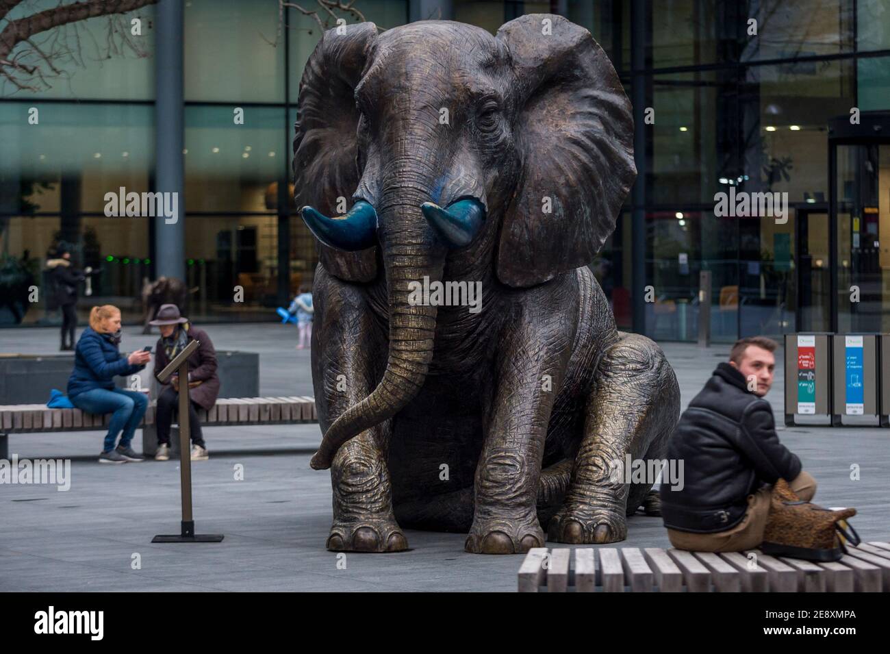 London, UK. 1 February 2021. People next to the largest of a series of