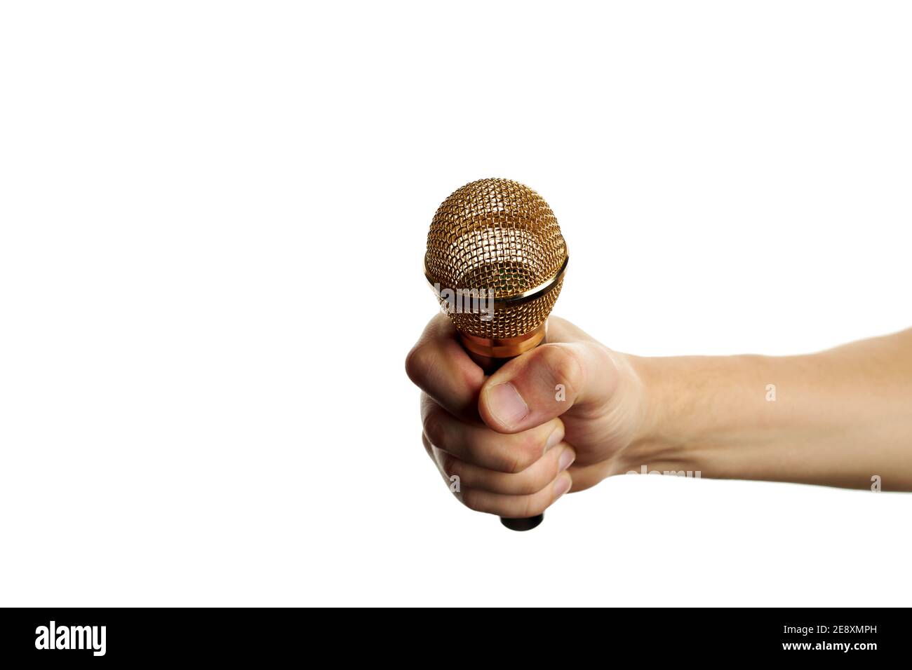 golden microphone in hand isolated on a white background. copy space. sound recording equipment. Stock Photo