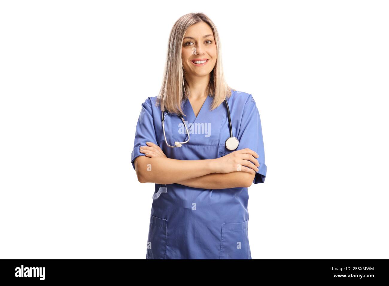 Female health care worker in a blue uniform smiling at camera isolated on white background Stock Photo