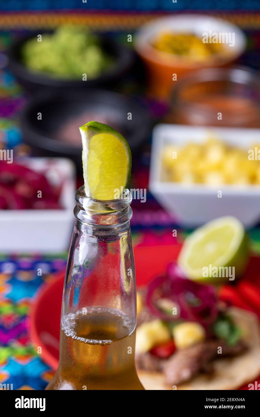 lime in a beer with mexican tortilla and salsas Stock Photo Alamy