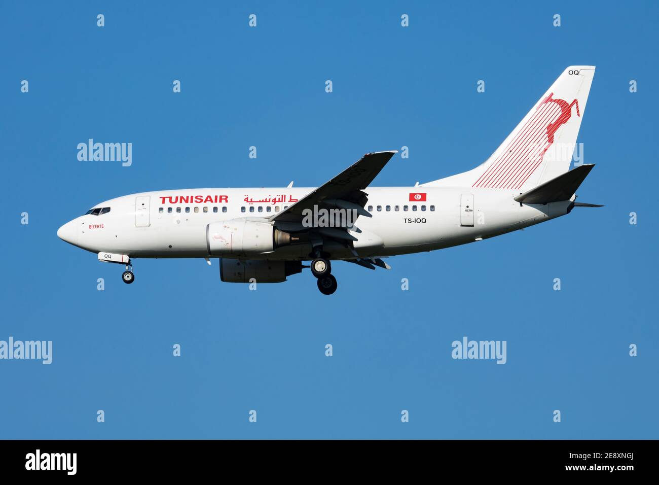 Tunisair Boeing 737-600 TS-IOQ passenger plane arrival and landing at Vienna Airport Stock Photo